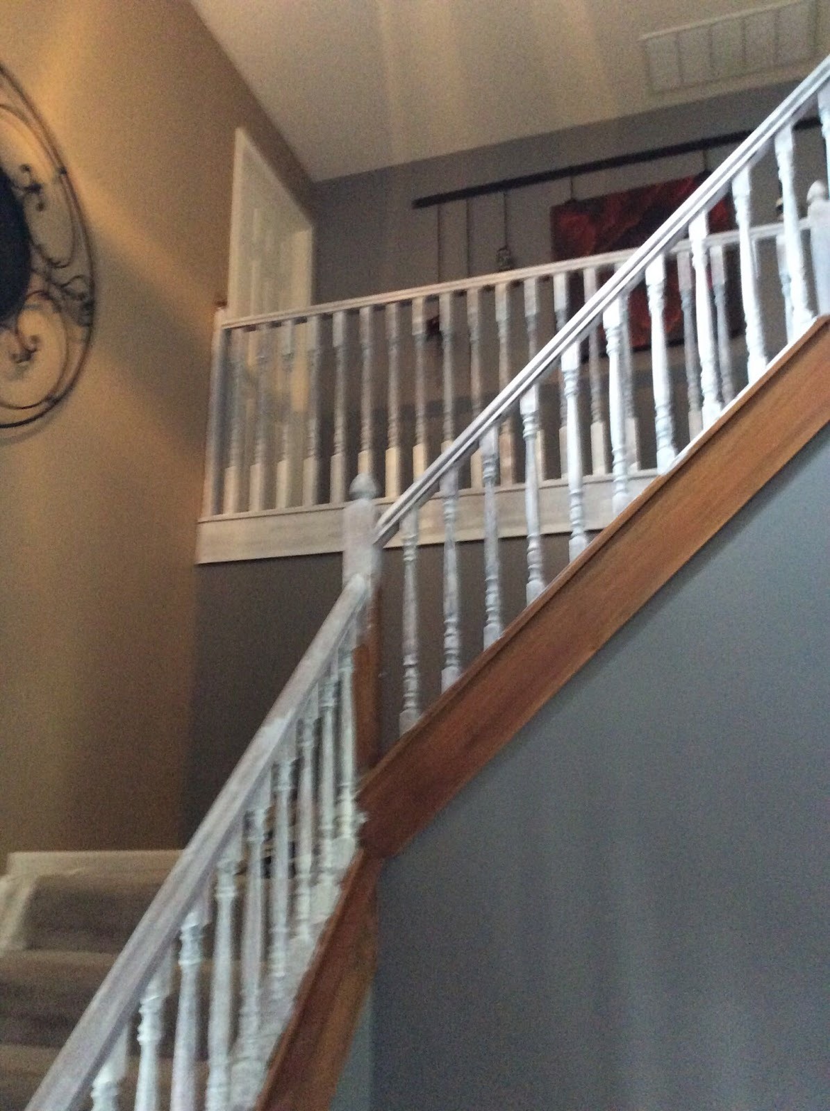 White stair balustrade against a soft grey wall